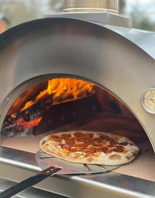 pizza being baked with Cru Champion Oven