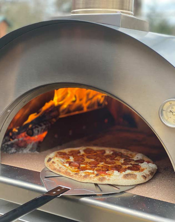 pizza being baked with Cru Champion Oven